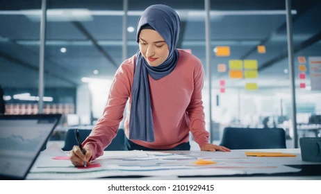 Woman coding in modern office